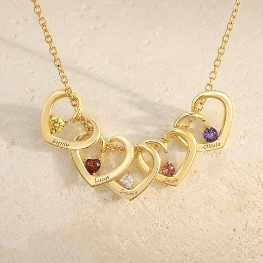 Gold twisted heart necklace with engraved family names and birthstones