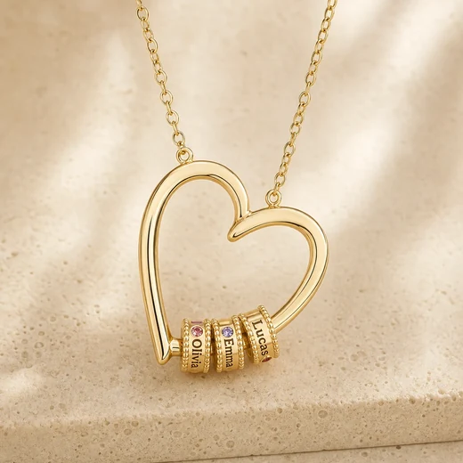 Gold tone open-heart necklace with individually engraved name beads