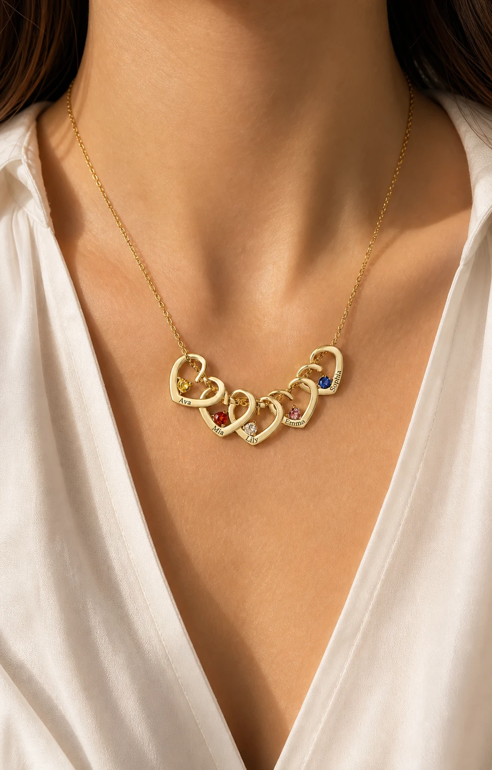 Close view of an engraved multi-heart birthstone necklace