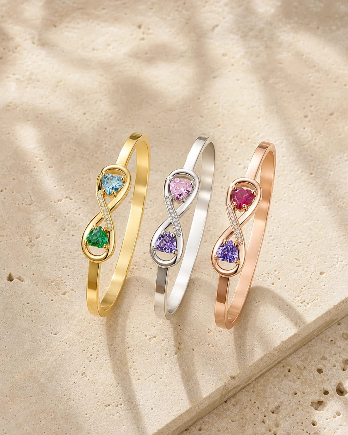Three personalized birthstone cuffs in silver gold and rose gold finishes