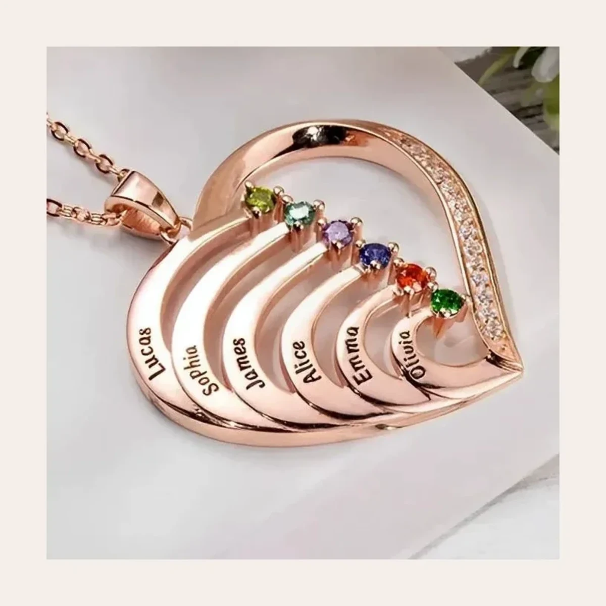 Personalized heart necklace showing engraved family details
