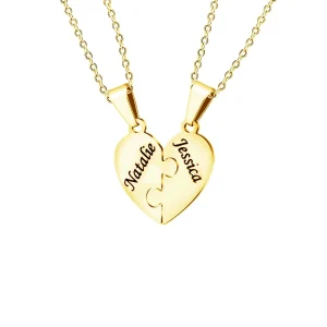 Gold tone two-piece heart puzzle necklace with one engraved name on each piece