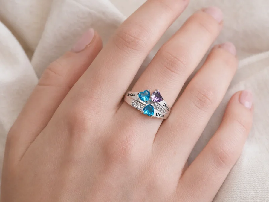 Family constellation name ring with a colorful birthstone cluster shown on a hand