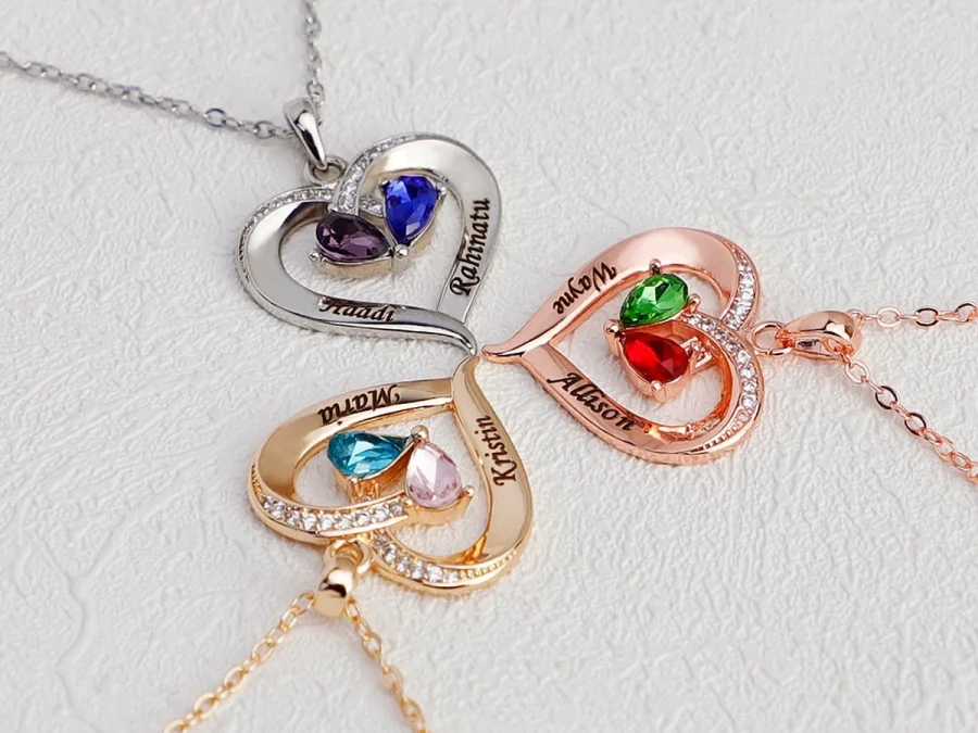 Two-tone teardrop necklace shown in stainless-steel, rose-gold, and gold-tone options