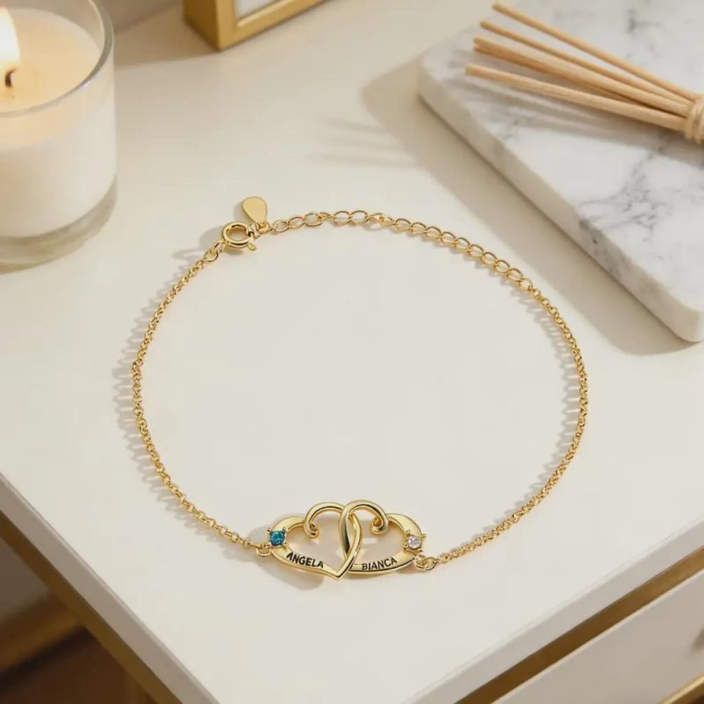 Personalized double heart bracelet with two engraved names and two birthstone accents in rose gold tone