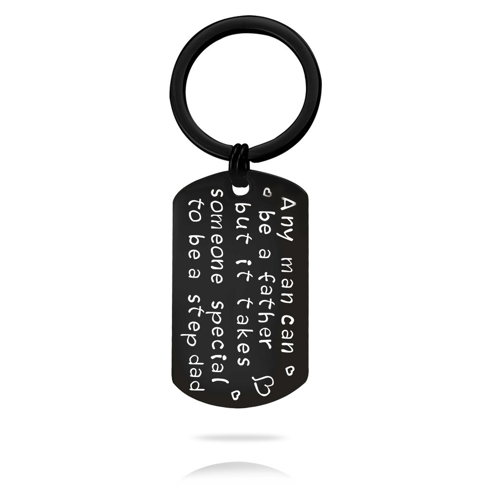 Engraved stainless steel dog tag keychain with a single birthstone accent