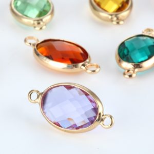Gold oval pendant necklace engraved with a single name above a glass birthstone