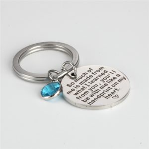 Stainless steel keychain engraved with a name and set with a colored birthstone crystal