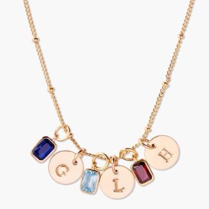 Necklace with an initial disc and a diamond accent