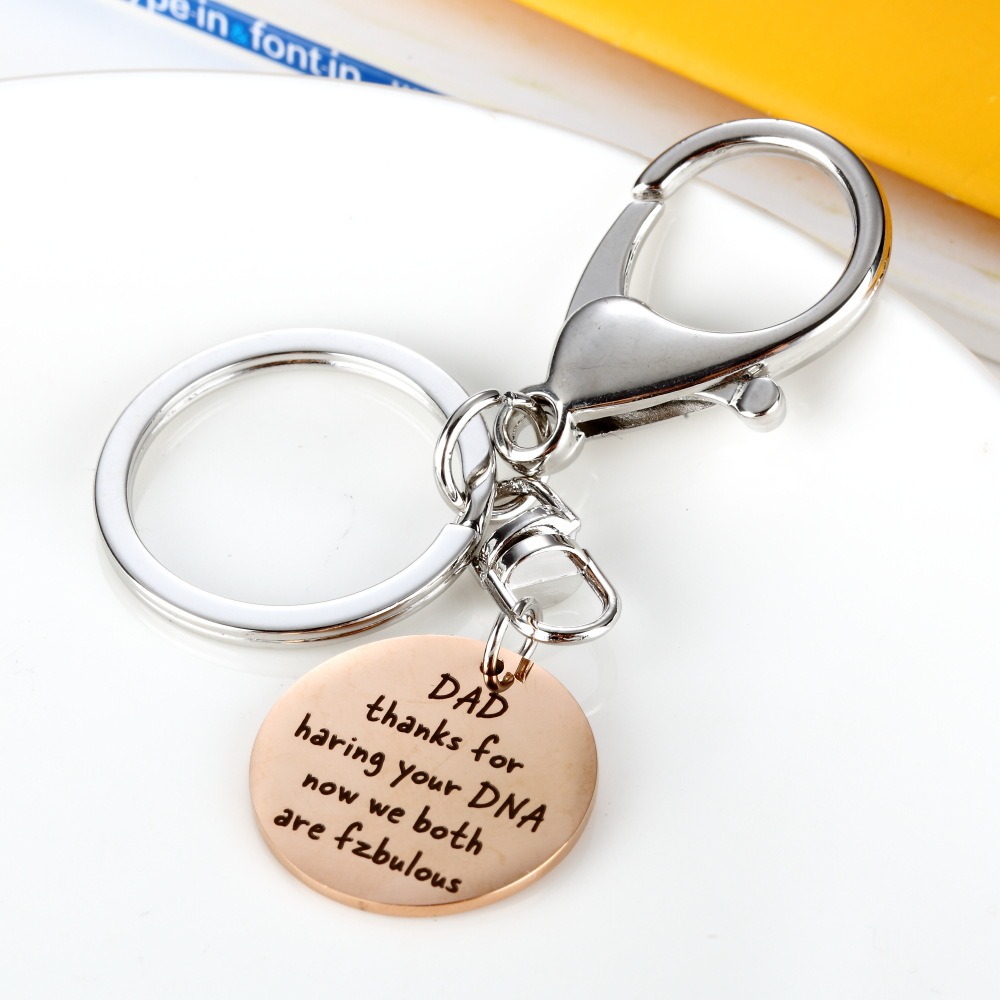 Stainless steel dad keychain with engraved name and a single birthstone charm