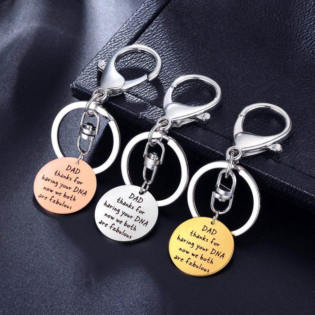 Stainless steel dad keychain with engraved name and a single birthstone charm
