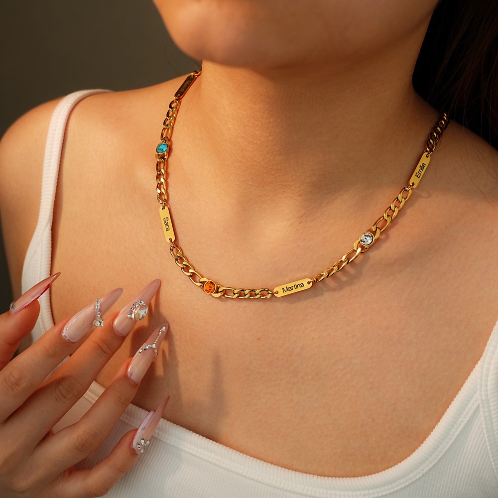 Stainless steel Cuban link necklace with a custom engraved name bar and a single birthstone charm