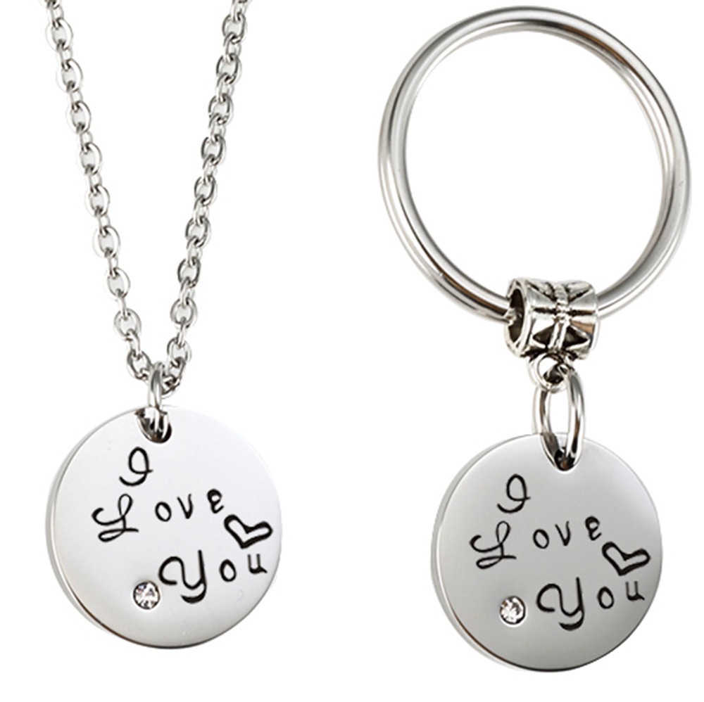 Stainless steel couple set with two engraved heart pendants, birthstones and a coil keychain