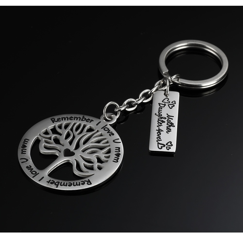 Steel life tree keychain with a single line of engraved text and one birthstone charm