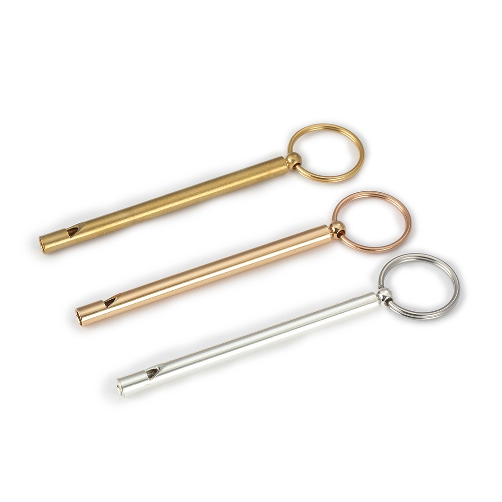 Engraved brass whistle keychain with a coil keyring and optional birthstone