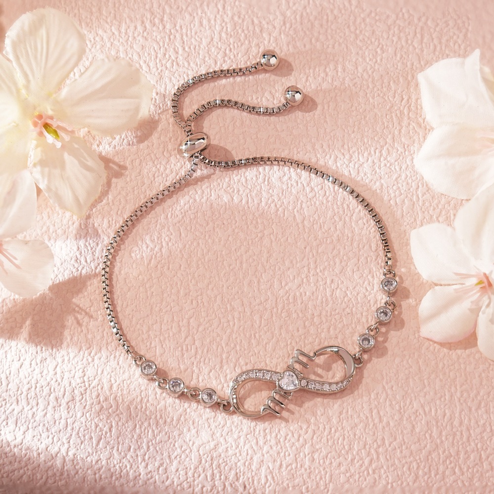 Stainless steel MOM infinity bracelet with single-line engraving and a birthstone accent