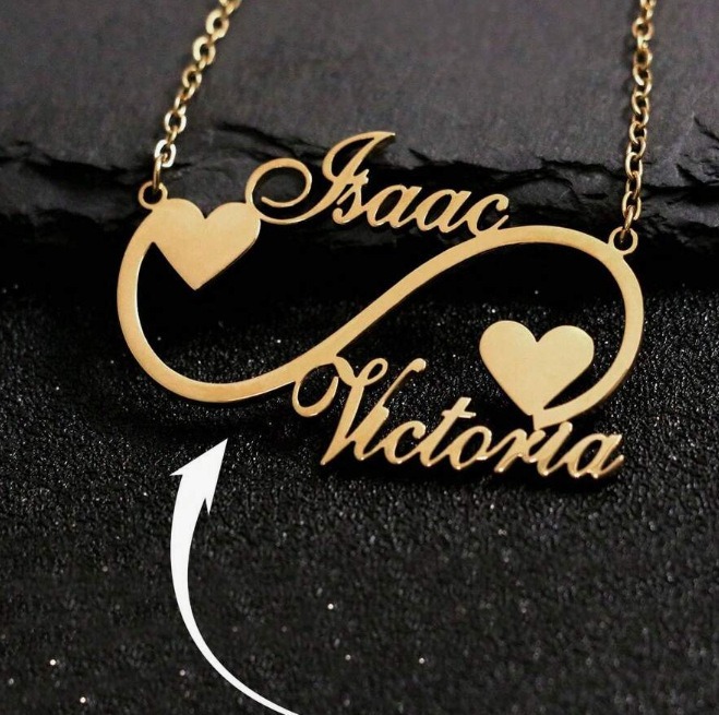 Open heart infinity pendant necklace with single-line engraving and tiny birthstone accent on a stainless steel O-link chain