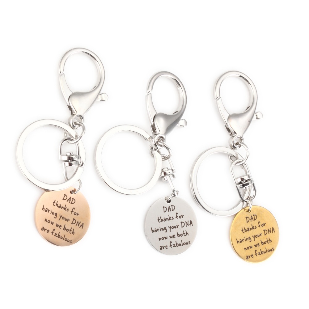 Stainless steel dad keychain with engraved name and a single birthstone charm