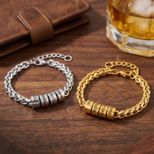 Stainless steel Cuban link bracelet with an engraved bead and birthstone accent