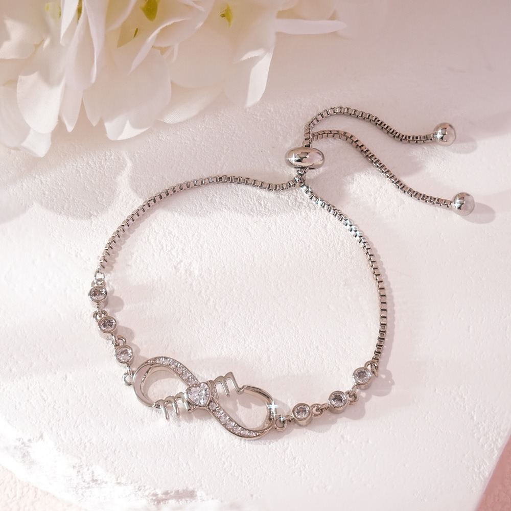 Stainless steel MOM infinity bracelet with single-line engraving and a birthstone accent
