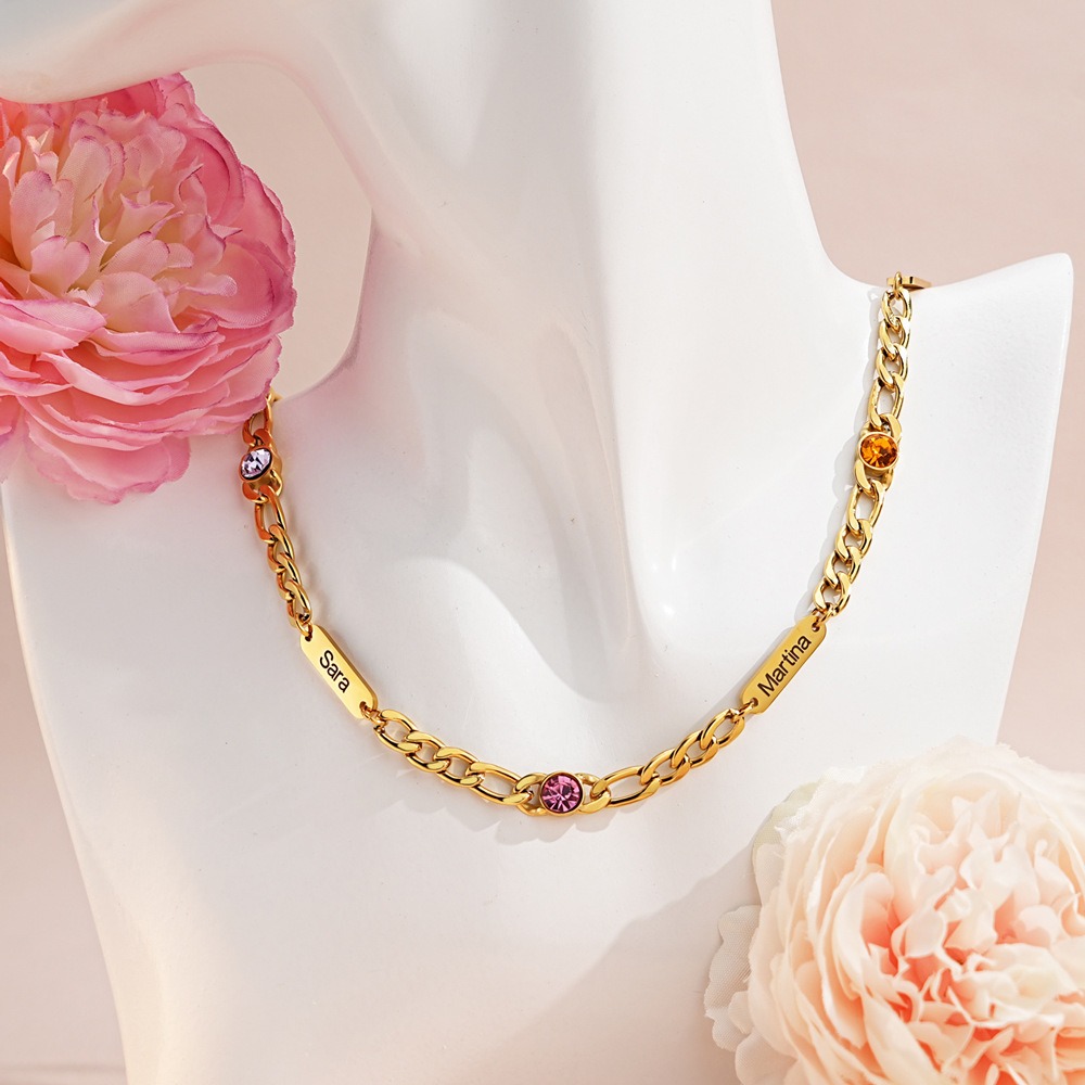 Stainless steel Cuban link necklace with a custom engraved name bar and a single birthstone charm