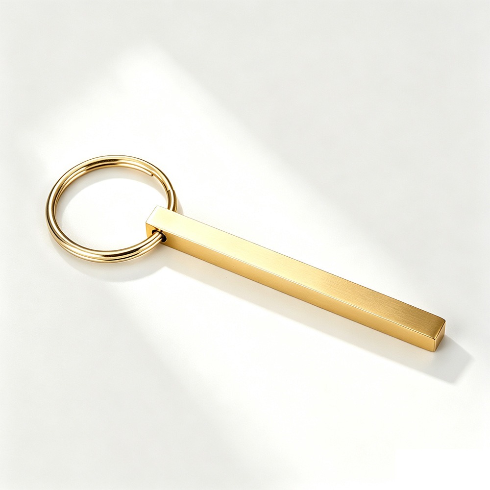 Polished stainless steel bar keychain engraved with a name and set with a single birthstone — Gold Tone