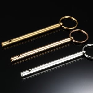 Engraved brass whistle keychain with a coil keyring and optional birthstone