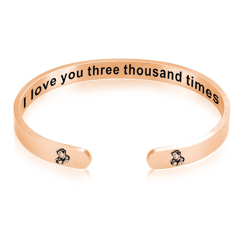 Stainless steel open cuff bracelet engraved with a name and a single birthstone