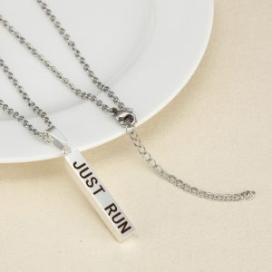 Vertical stainless steel bar necklace with custom single line engraving and optional birthstone, shown in gold tone