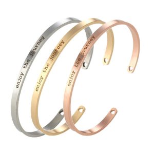 Engraved stainless steel open cuff bracelet with a single birthstone accent