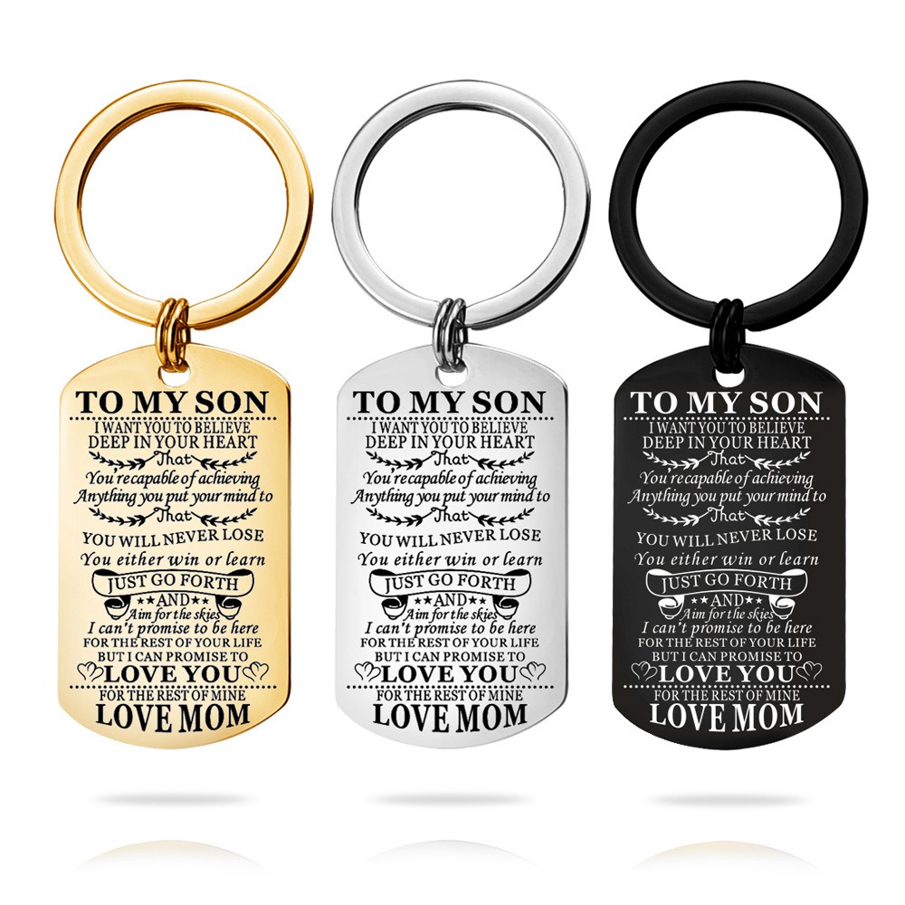 Engraved stainless steel dog tag keychain with a single birthstone accent