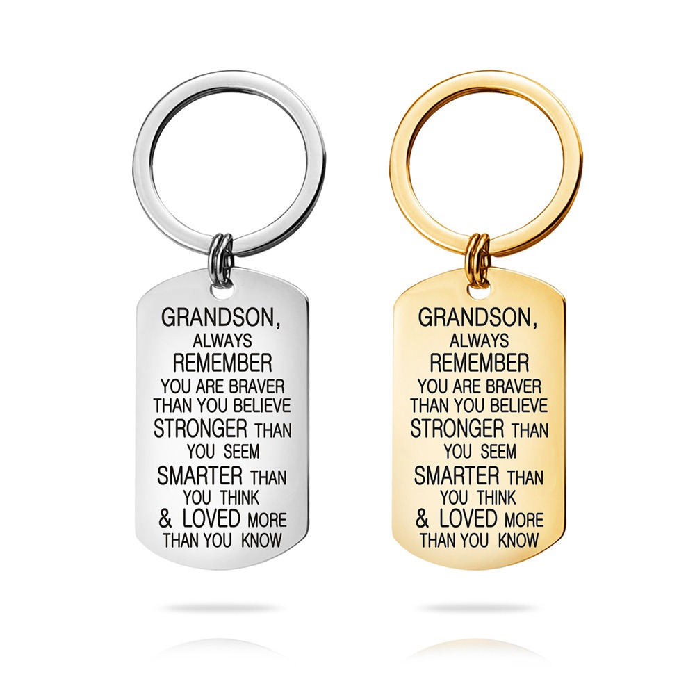 Engraved stainless steel dog tag keychain with a single birthstone accent