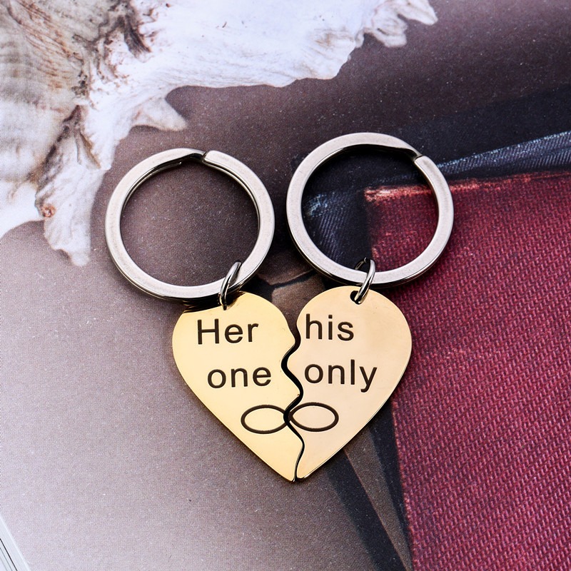 Pair of stainless steel heart keychains engraved with two names and set with birthstones
