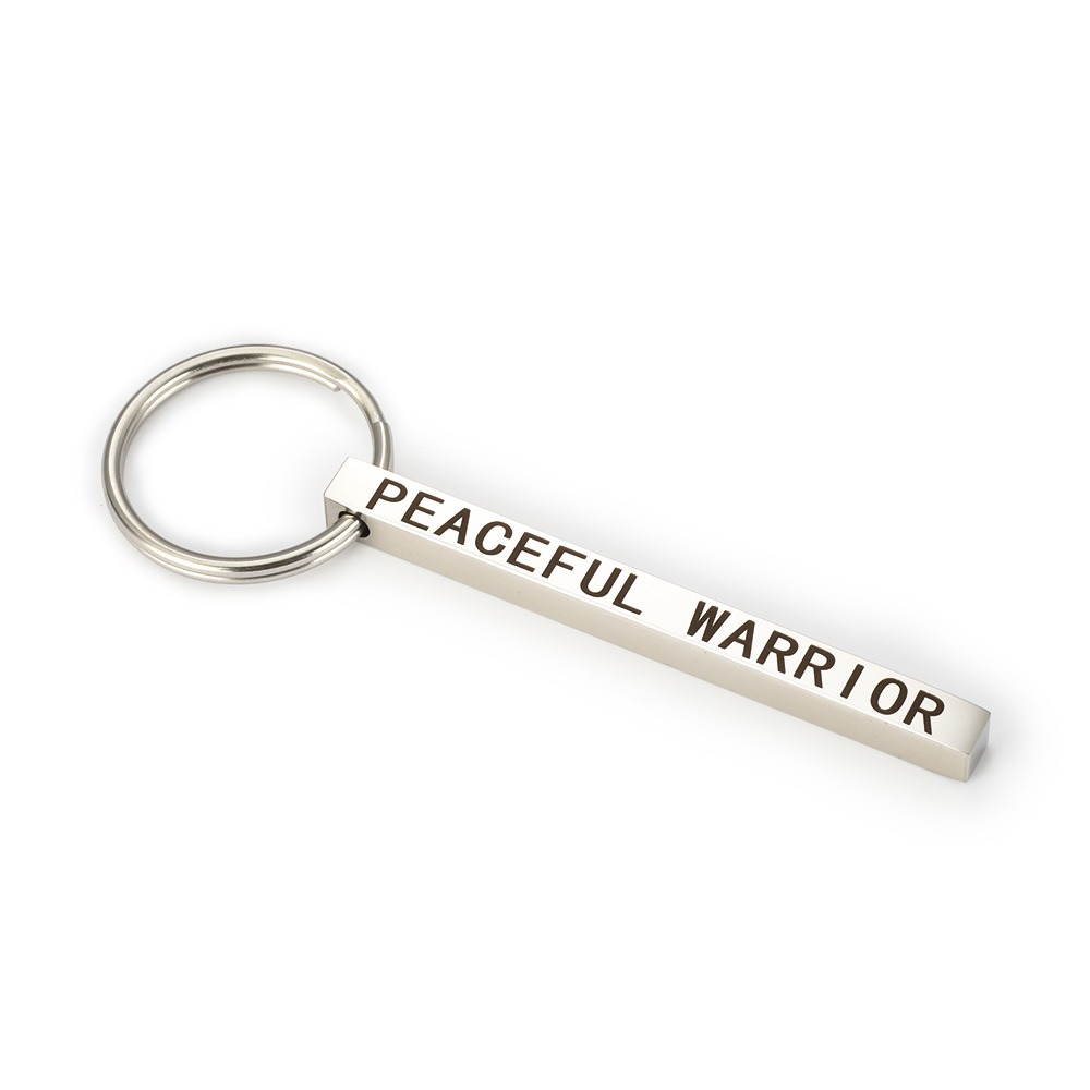 Polished stainless steel bar keychain engraved with a name and set with a single birthstone