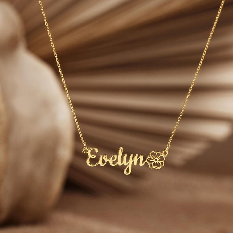 Custom stainless steel name necklace with single line cut name and small birthstone accent