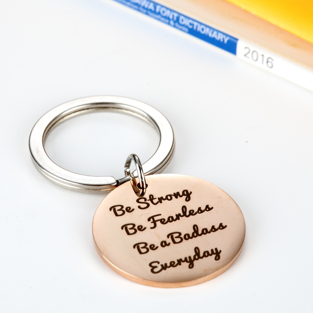 Stainless steel keychain with a custom engraved name and a birthstone charm