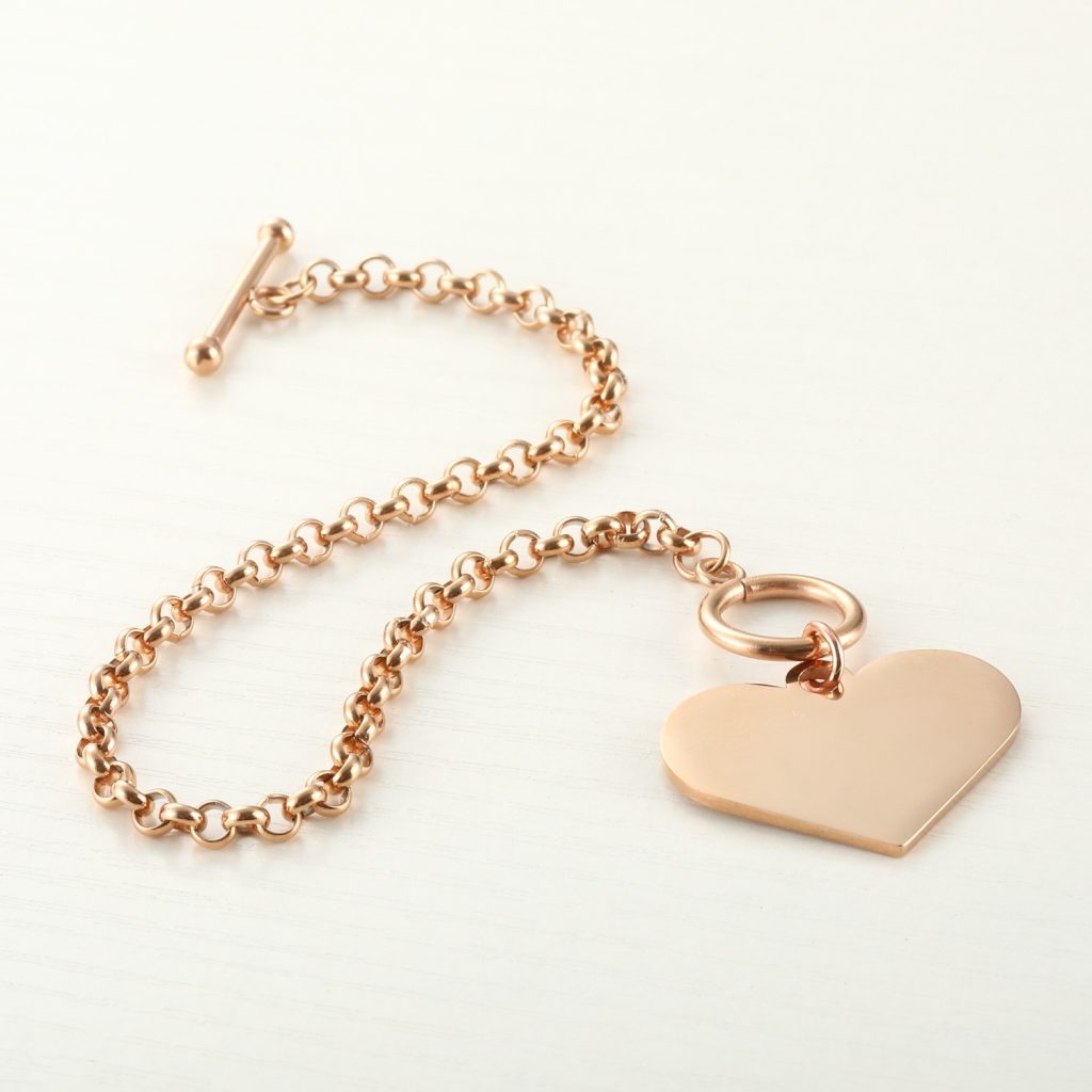 Double sided photo heart bracelet with engraved message in rose gold