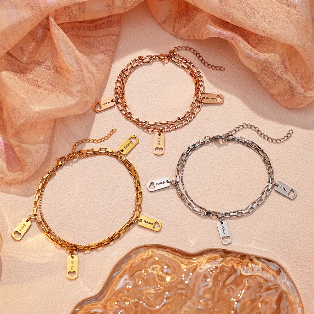Open heart charm bracelet with engraved heart and birthstone on a two-layer chain