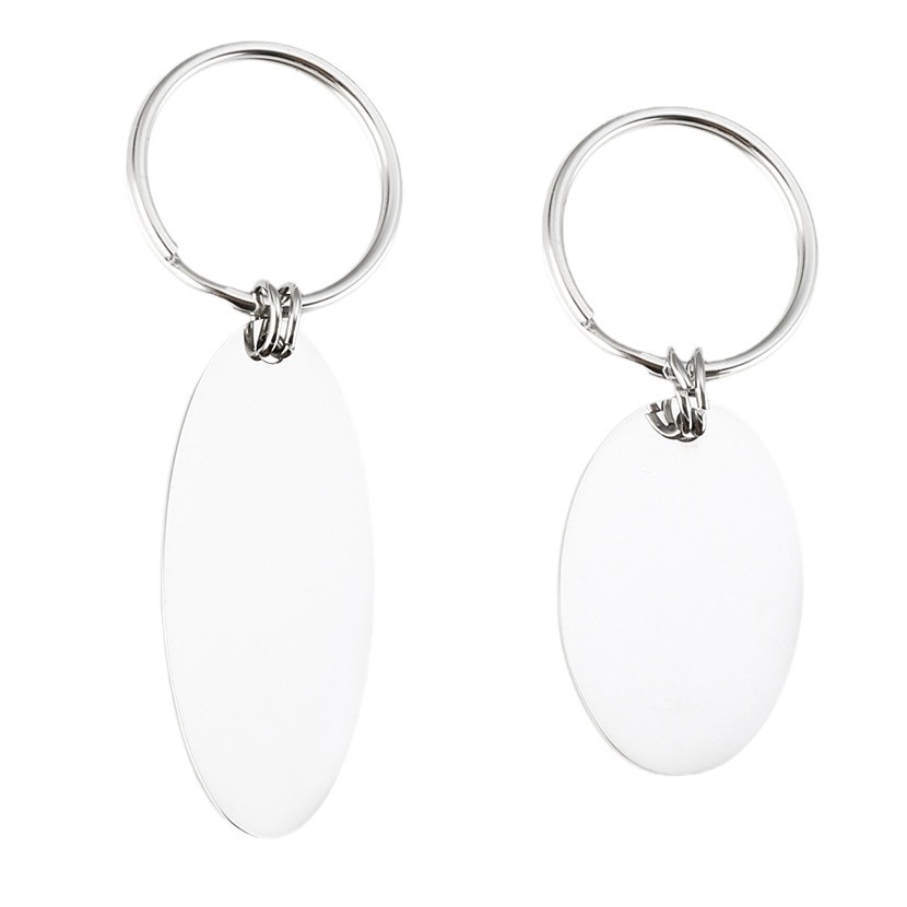 Polished oval stainless steel keychain engraved with a name and a single birthstone