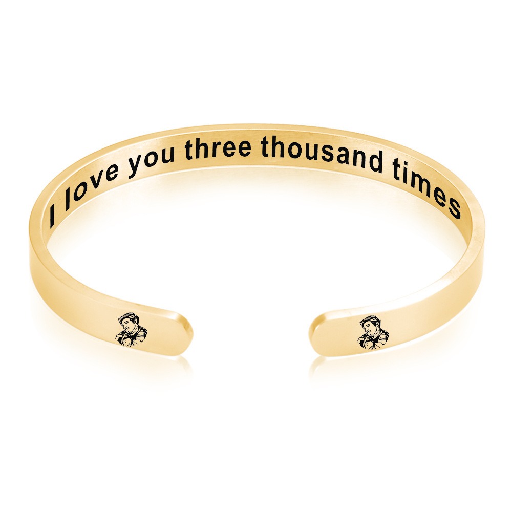 Stainless steel open cuff bracelet engraved with a name and a single birthstone