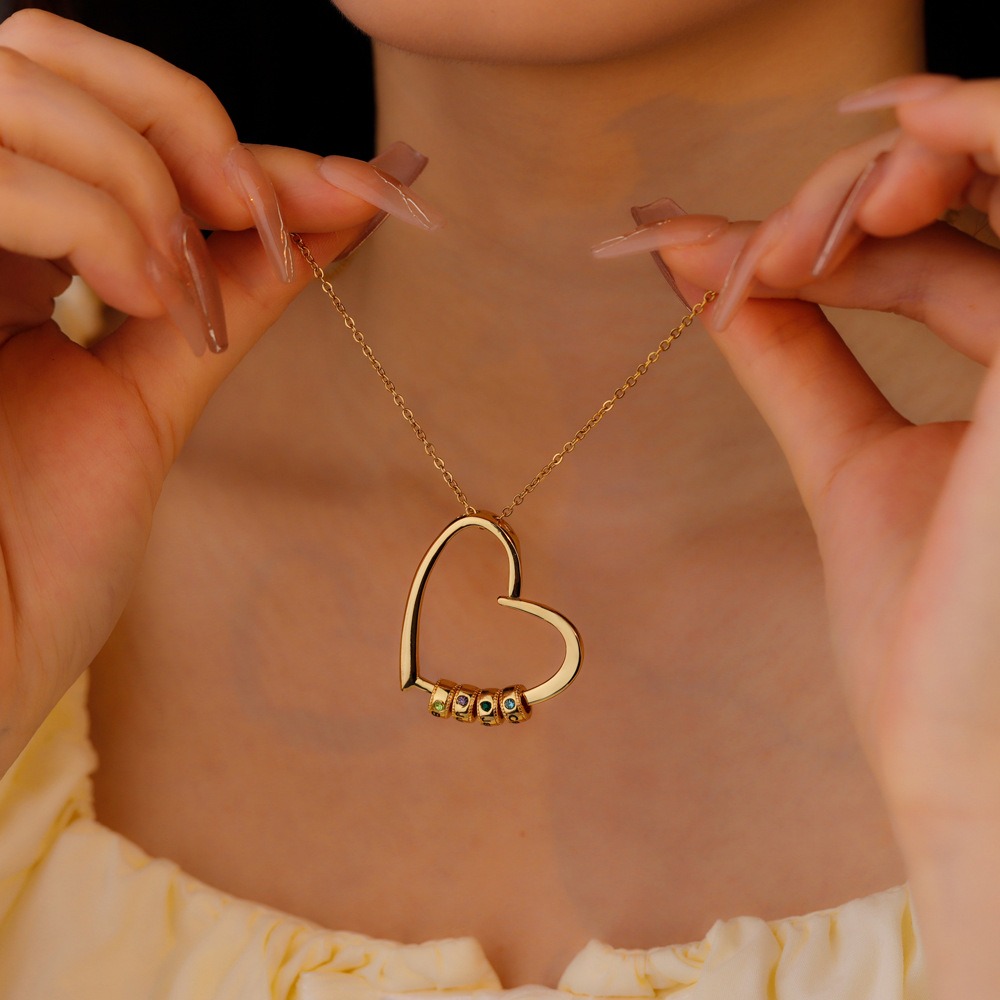 A name bead necklace shown when worn