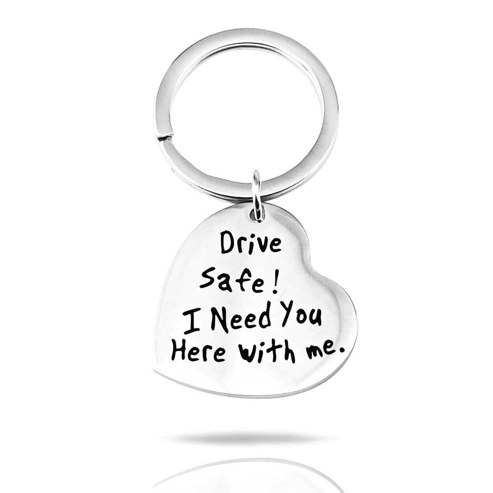 Stainless steel keychain with an engraved name and a small birthstone charm