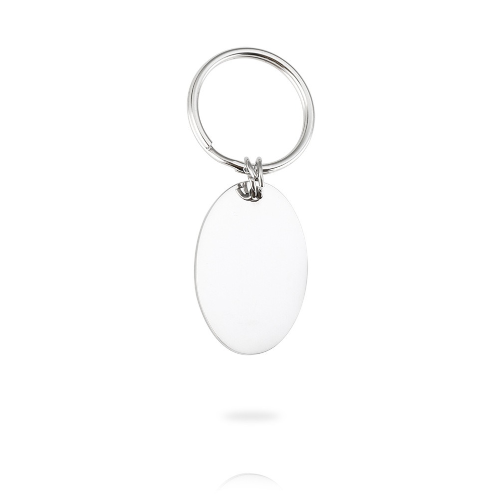 Polished oval stainless steel keychain engraved with a name and a single birthstone