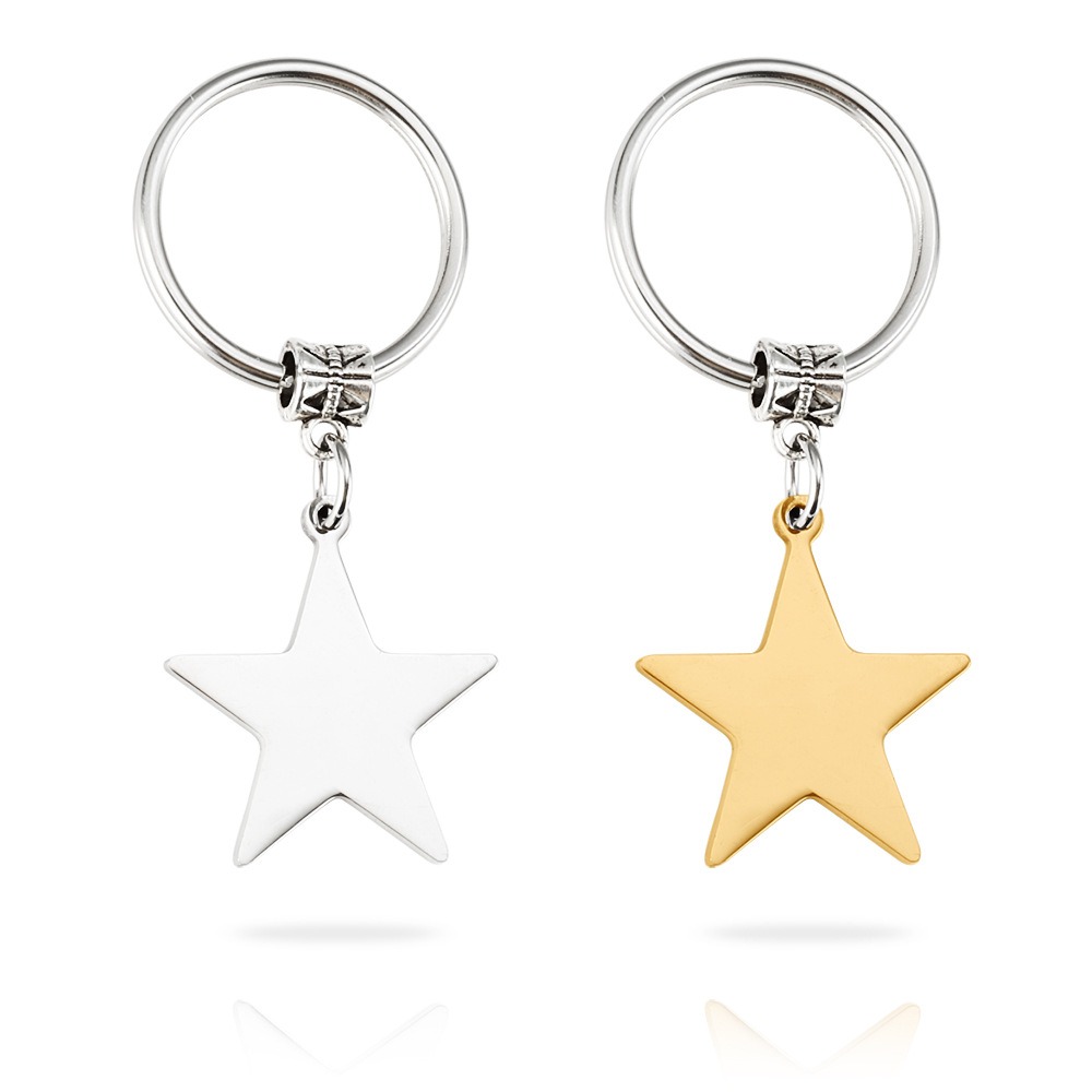 Stainless steel star keychain engraved with a name, shown in gold-tone and steel-tone finishes