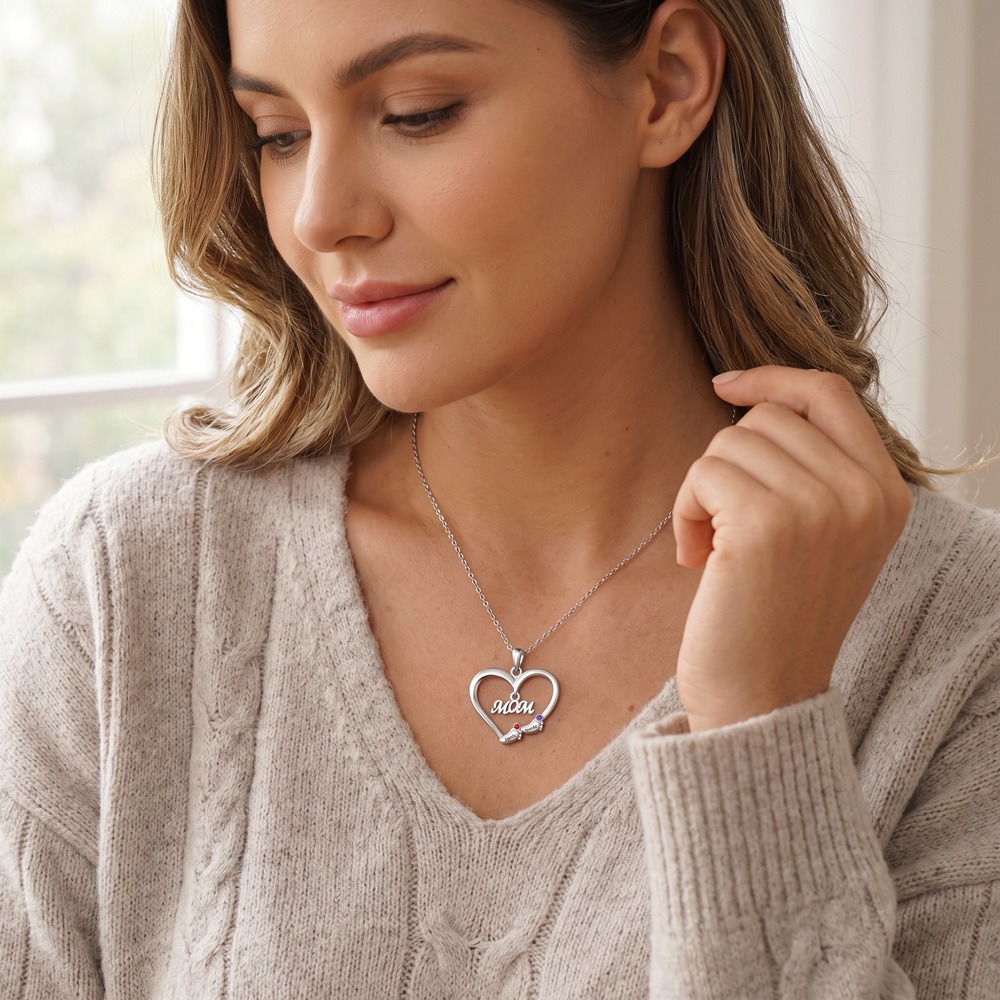 Baby feet necklace with a Grandma pendant, engraved name and birthstone on a stainless steel chain