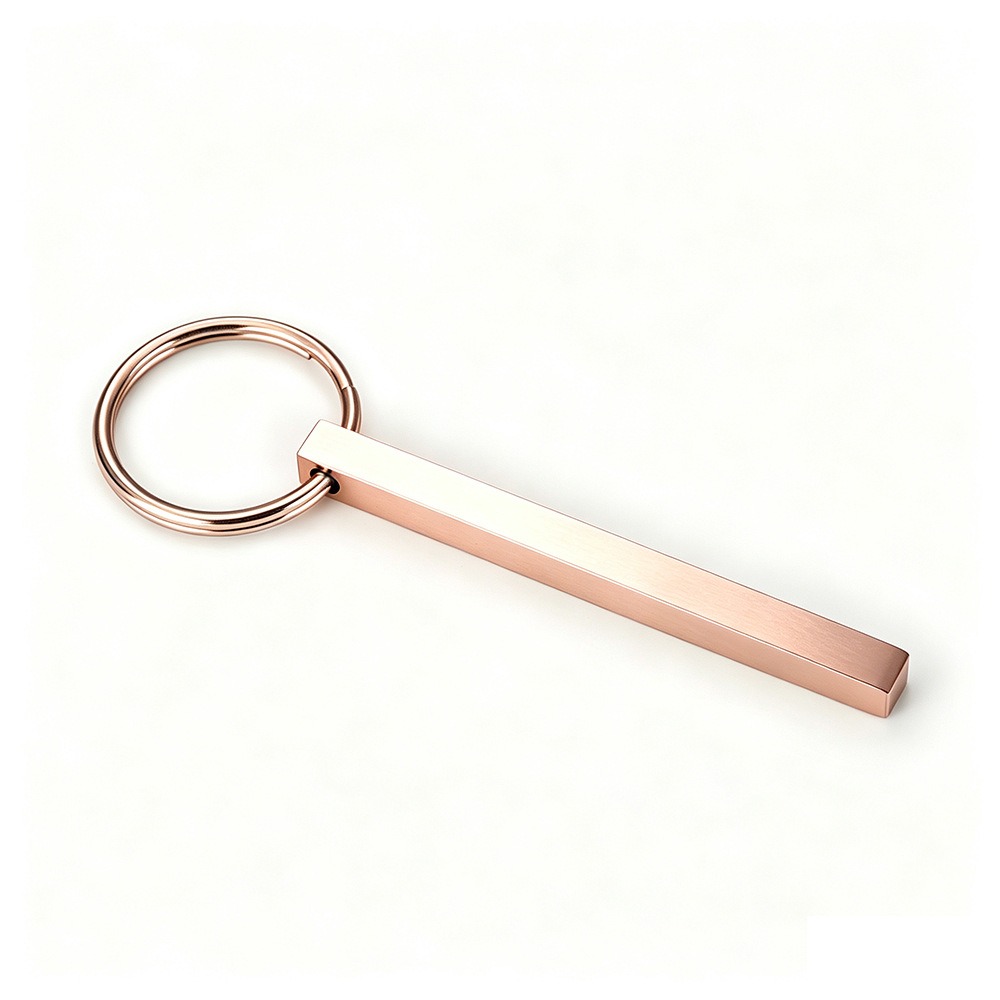 Polished stainless steel bar keychain engraved with a name and set with a single birthstone — Rose Gold Tone