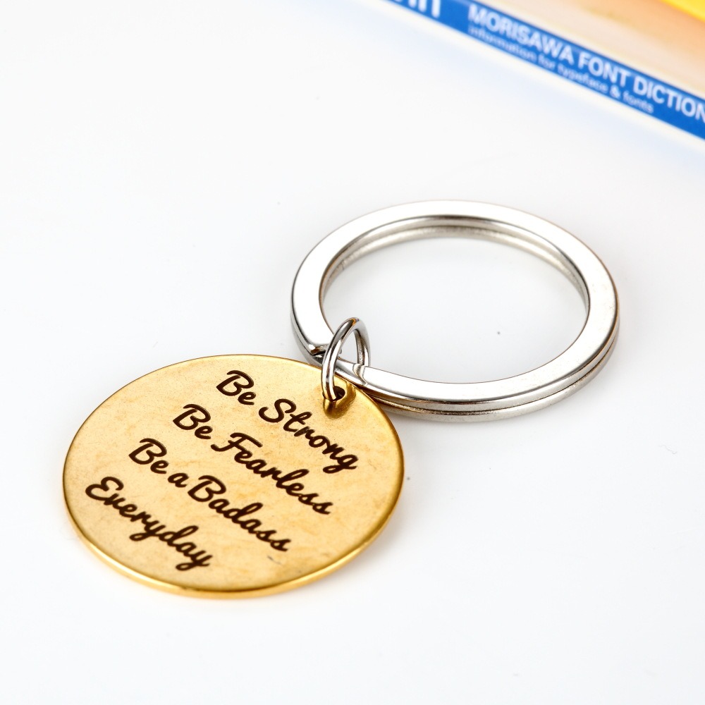 Stainless steel keychain with a custom engraved name and a birthstone charm
