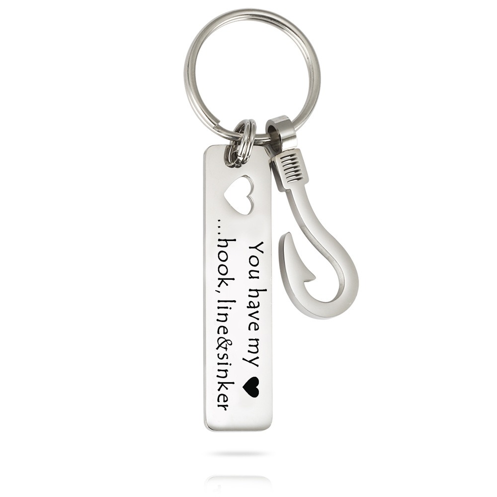 Stainless steel fish hook keychain with a rectangular hollow heart and an engraved name