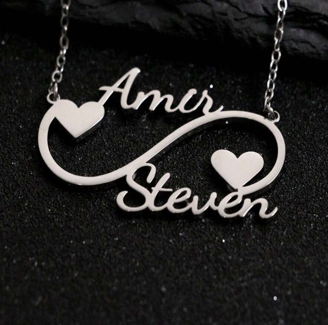 Open heart infinity pendant necklace with single-line engraving and tiny birthstone accent on a stainless steel O-link chain