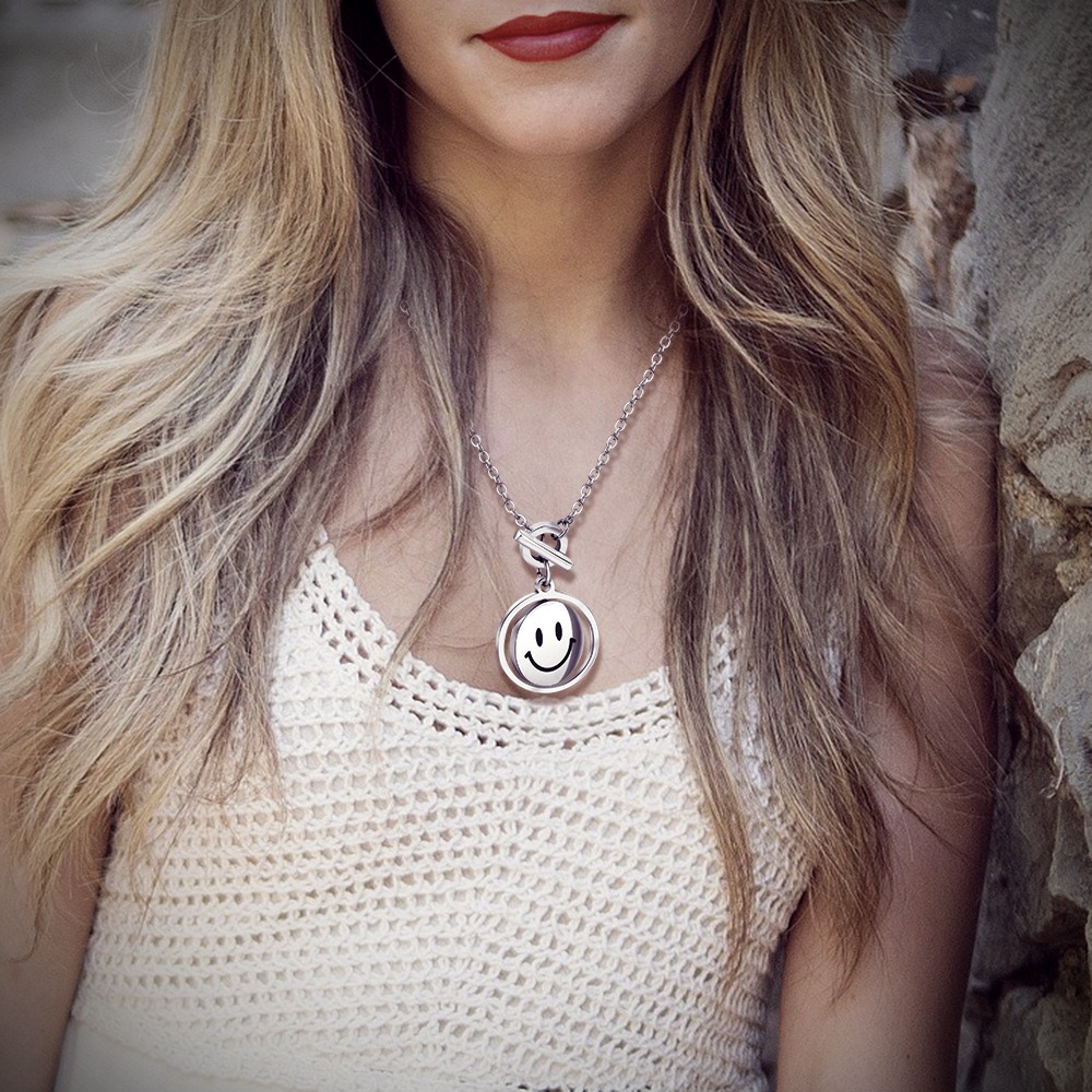 Rotating smile pendant necklace with a photo print
